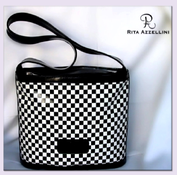 L'azienda Rita Azzellini propone una pregiata linea di borse, uniche per stile e manifattura artigianale. Infatti, ogni collezione firmata Rita Azzellini annovera una variet� di pezzi che sposano classico e moderno, un connubio di fantasia ed eleganza esaltato dall'alta qualit� del materiale utilizzato: "fine pellame di capretto", interamente lavorato a mano; da tutto questo ne deriva un prodotto finale che va ben al di l� del puro accessorio per un pubblico femminile. Il marchio Rita Azzellini garantisce, rispetta e preserva il "buon gusto" e la tradizione nel mondo del prodotto made in Italy